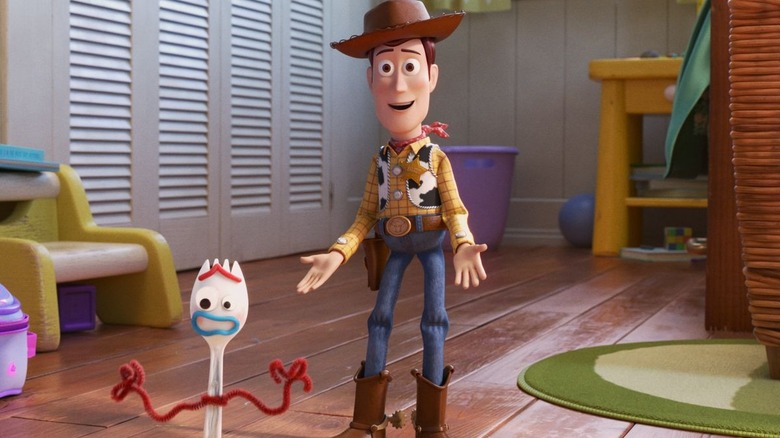 Forky and Woody with hands out