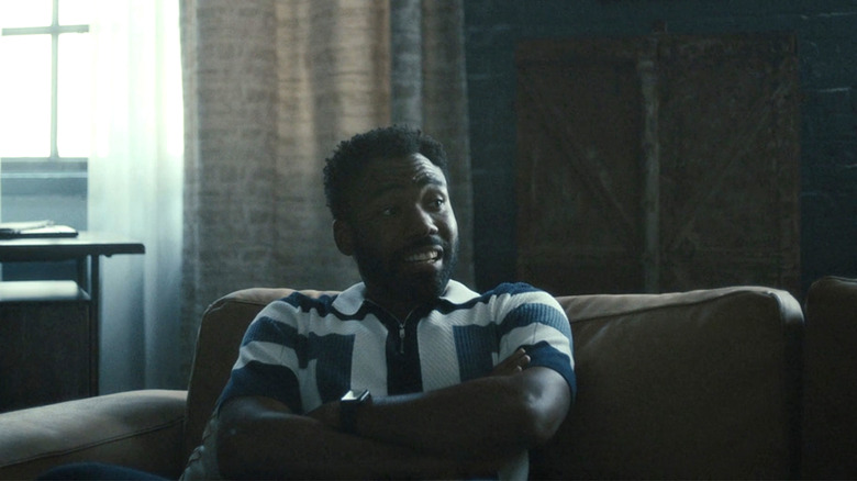 Earn (Donald Glover) sits on a couch on "Atlanta"