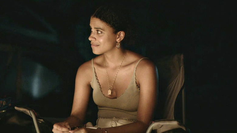 Van (Zazie Beetz) sits by a campfire on "Atlanta"