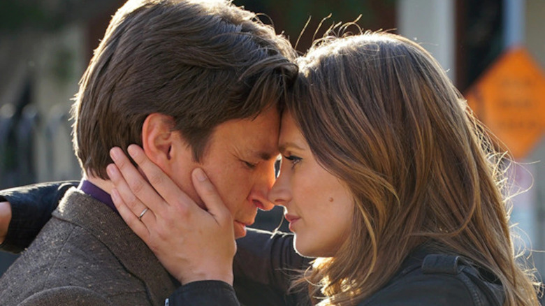 Beckett and Castle embrace