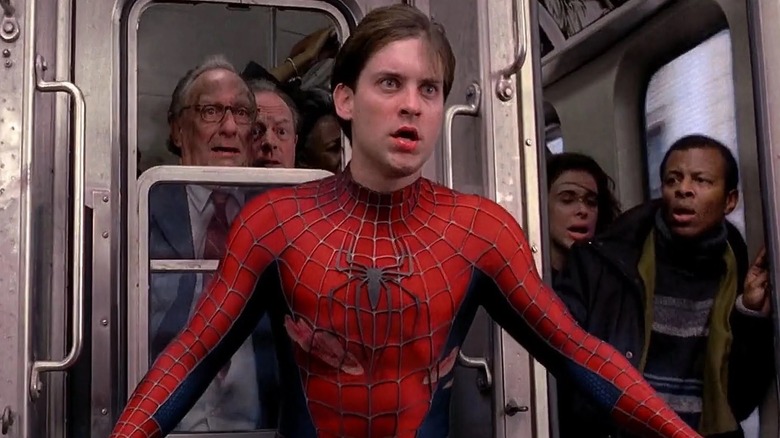 Spider-Man unmasked and people looking at him