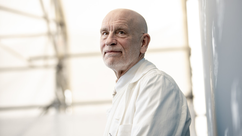 John Malkovich grinning