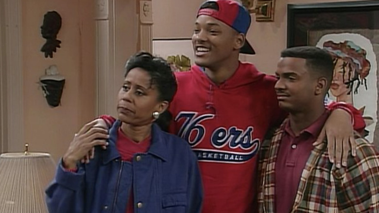 Will has arms over his mother and cousin Carlton