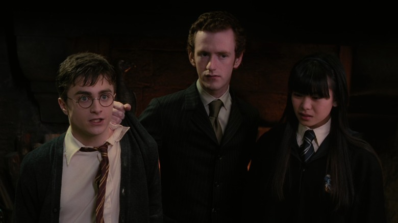 Percy detains Harry and Cho