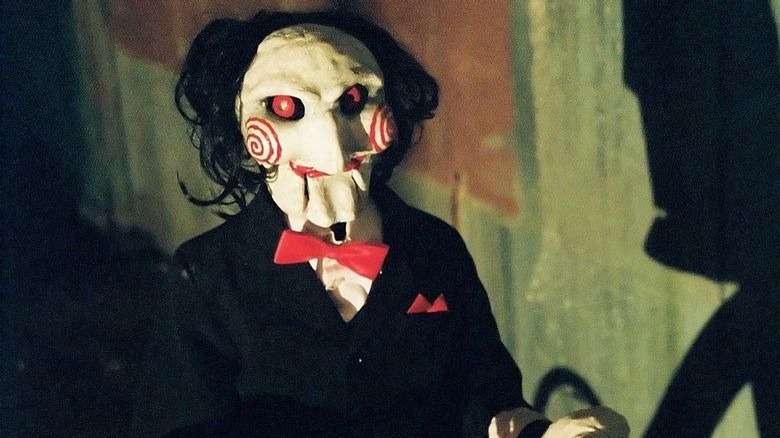 Billy the puppet riding a bicycle