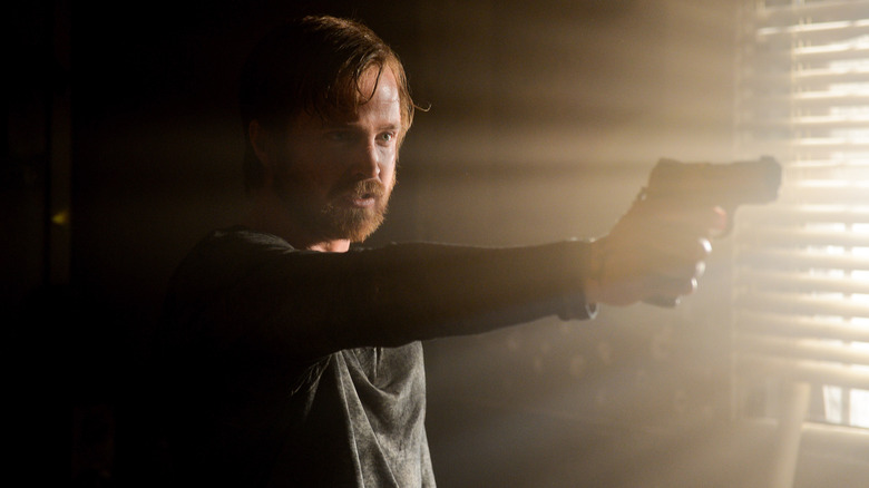 Aaron Paul aims as Jesse Pinkman