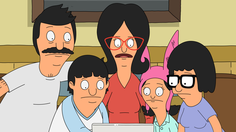 The Belcher family looking at computer