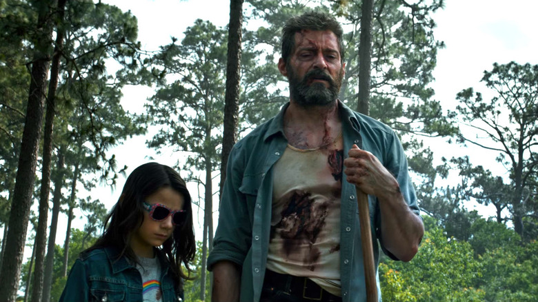 Logan and X-23 in woods