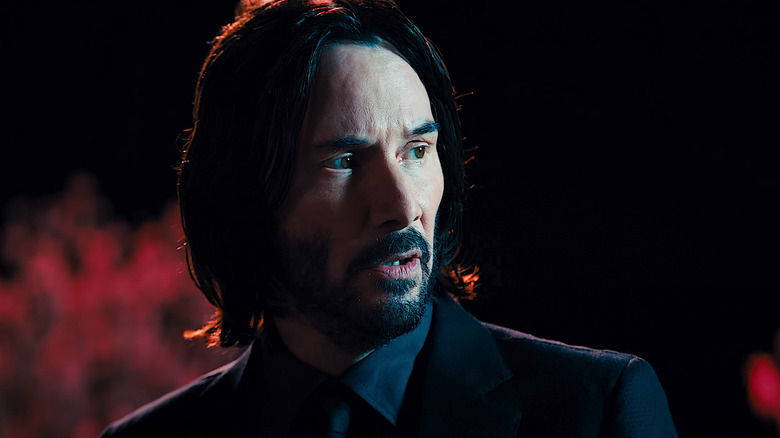 John Wick in the dark wearing suit