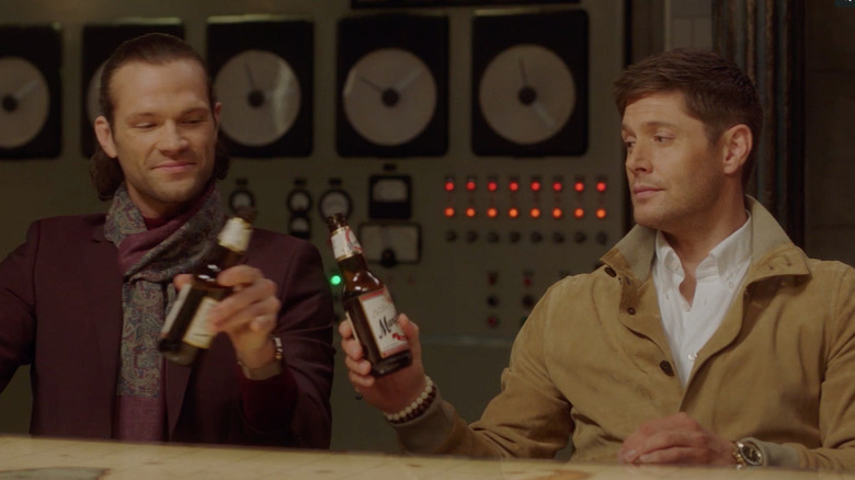 Hipster Dean and Sam clink beers