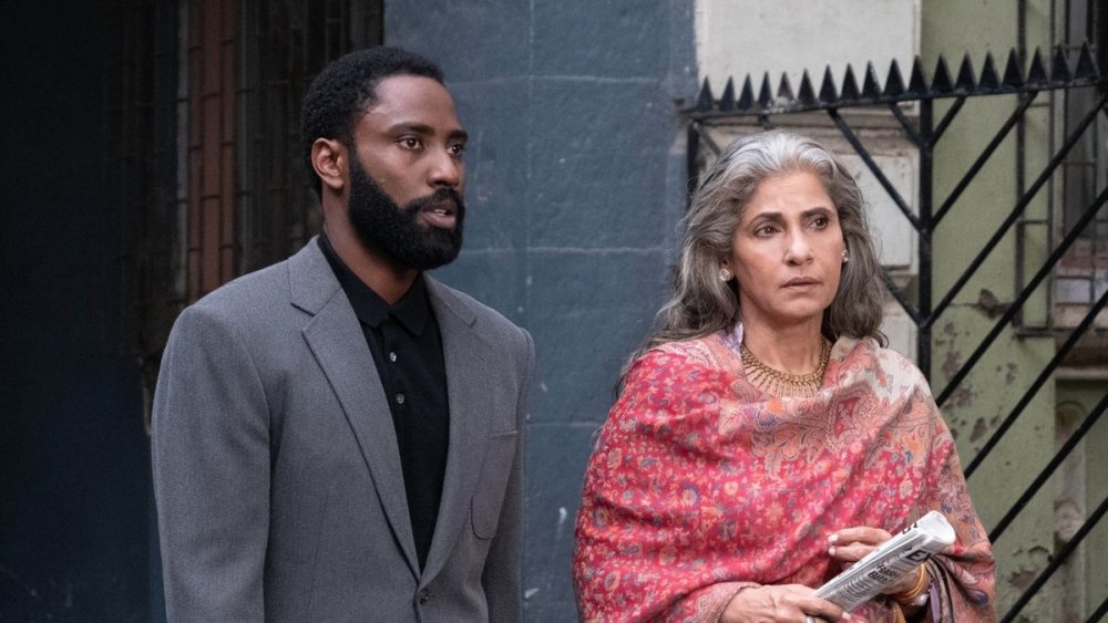 John David Washington and Dimple Kapadia as The Protagonist and Priya