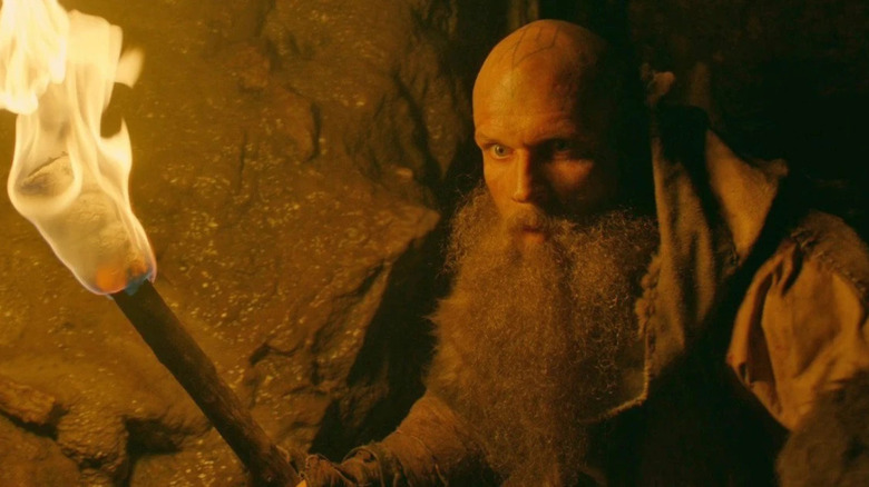 Floki holds torch