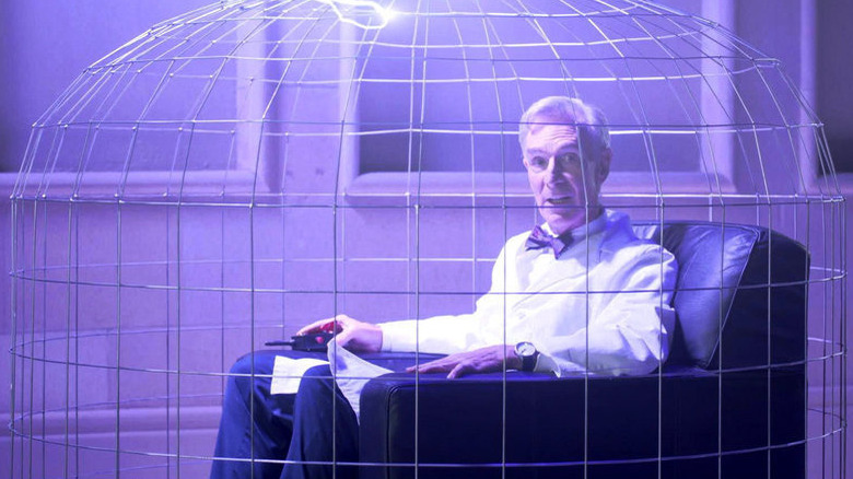 Bill Nye sitting in a faraday cage