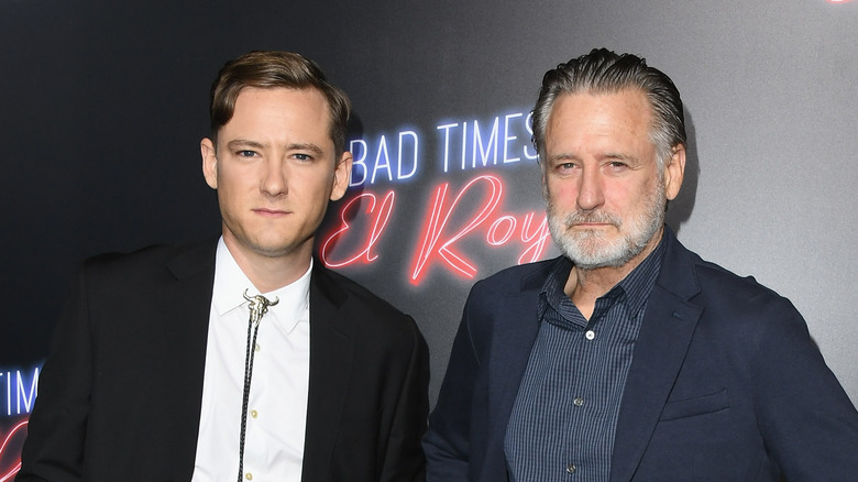 Lewis and Bill Pullman pose for a red carpet photo