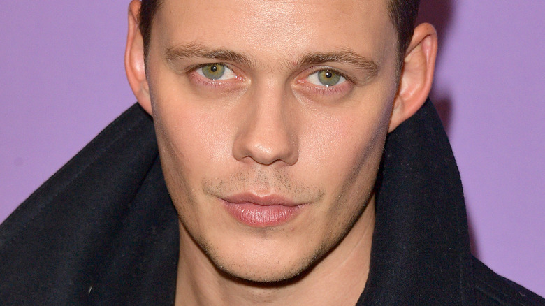 Bill Skarsgård smirking