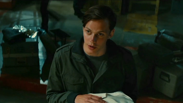 Skarsgård as Matthew holding sheets