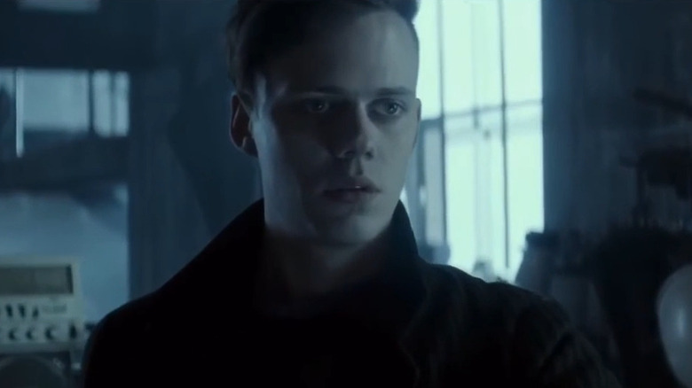 Bill Skarsgård in a warehouse