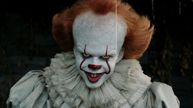 Pennywise grins malevolently