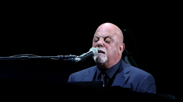 Billy Joel singing at his piano