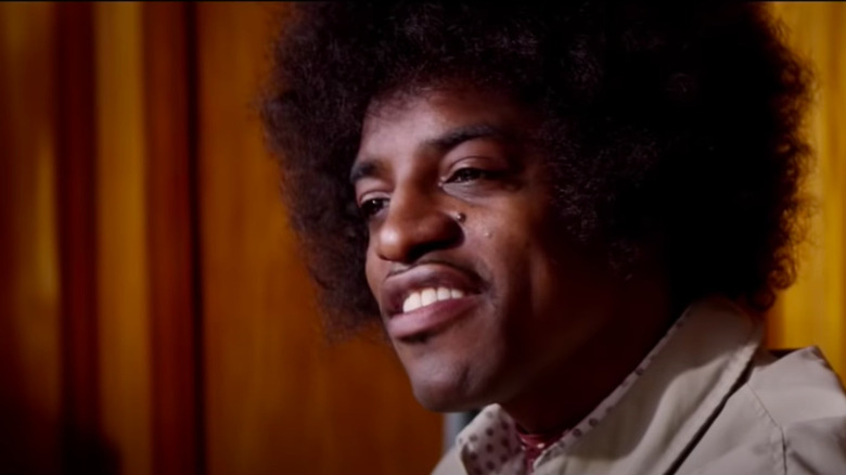  André 3000 as Jimi Hendrix, curling lip