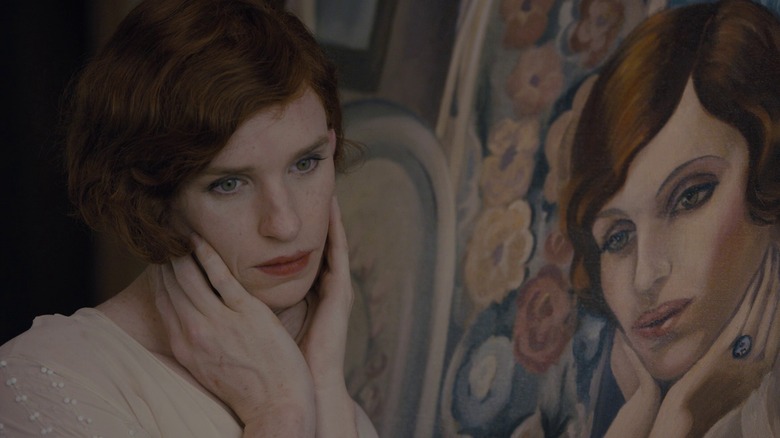 Eddie Redmayne as Lili Elbe, cupping face