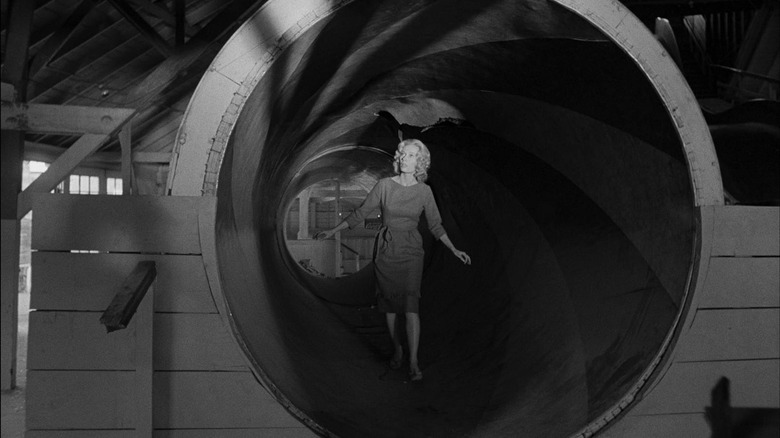 Candace Hilligoss walks through a tunnel