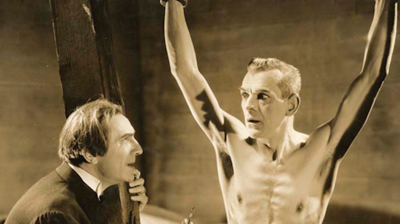 Bela Lugosi threatens a frightened Boris Karloff