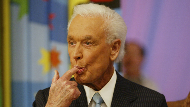 Bob Barker licks his finger