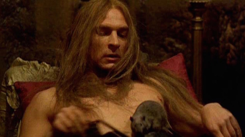 Julian Sands plays with rats