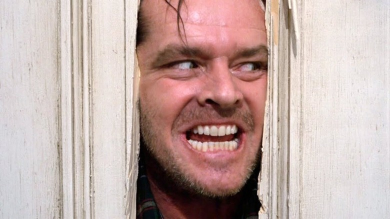 Jack Torrance poking his face through a door