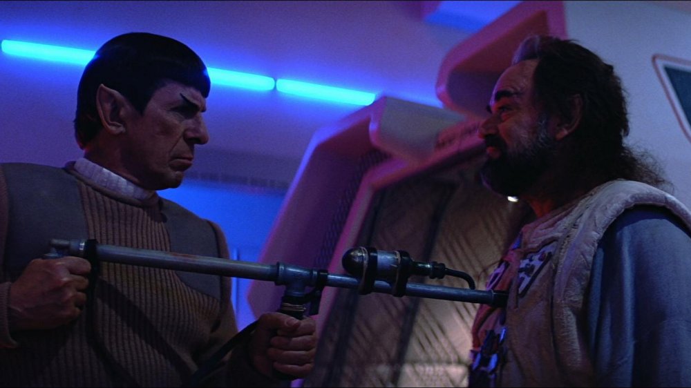 Spock holds a rifle to his brother Sybok's chest