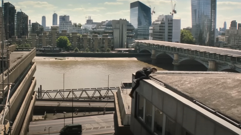 Ethan Hunt climbing a rooftop