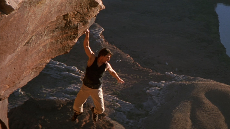 Ethan Hunt hanging off a cliff