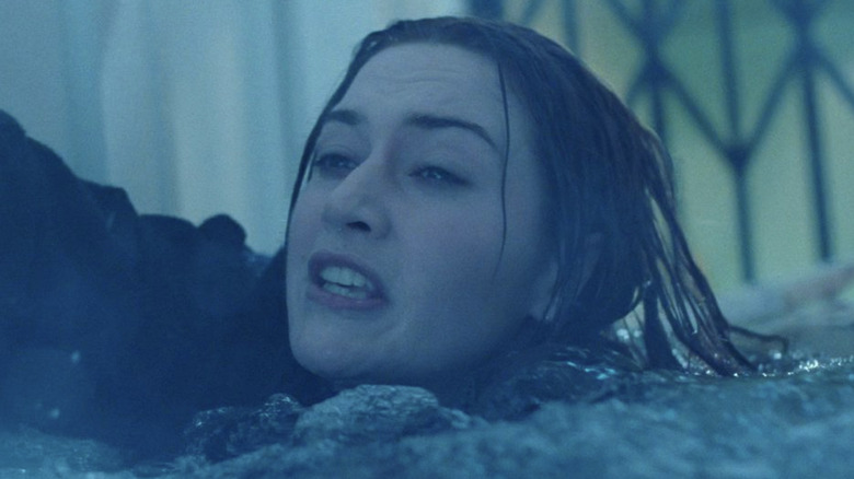 Kate Winslet reaching out of water
