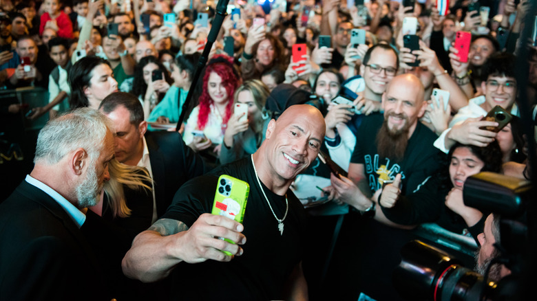 Dwayne Johnson with a crowd of fans at the Black Adam premier