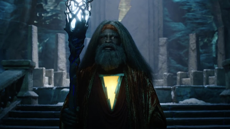 Djimon Hounsou as Shazam the wizard holding staff