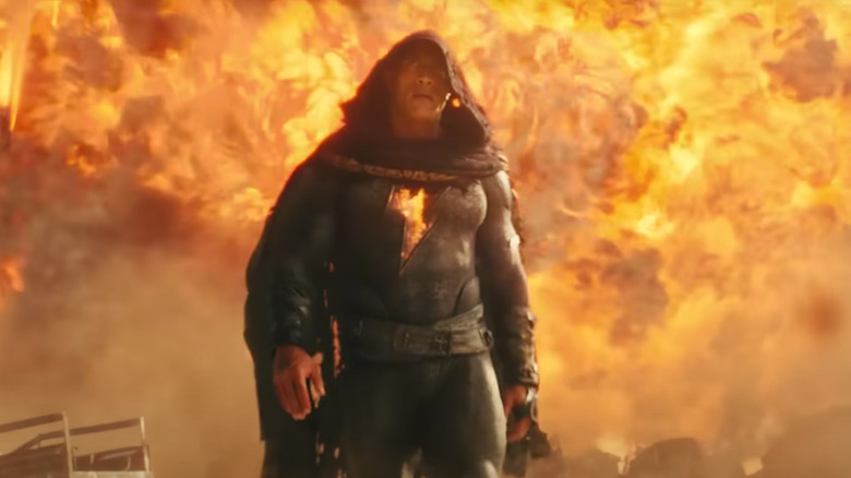 Black Adam stands amid the flames