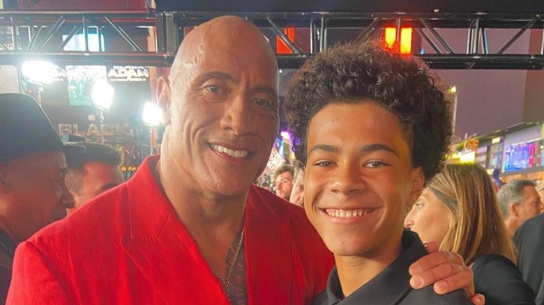 Dwayne "The Rock" Johnson and Jalon Christian smiling at Black Adam premiere