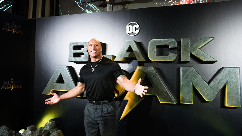 Dwayne Johnson posing for Black Adam press photos