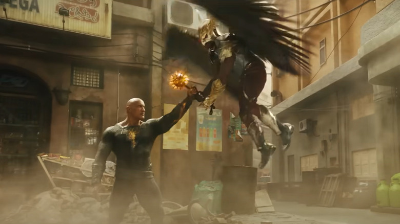 Black Adam catching Hawkman's mace