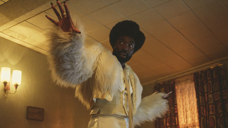 Paapa Essiedu wearing furry jacket