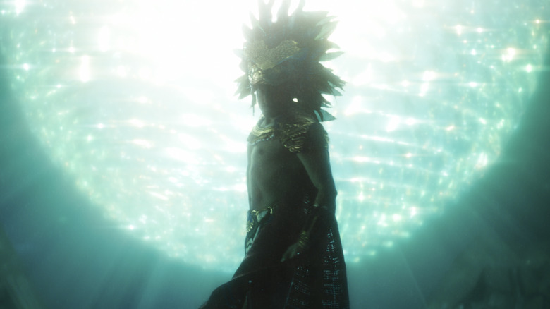 Namor underwater wearing a Mayan crown