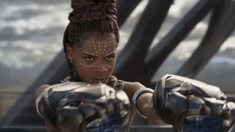 Shuri holding weapons in Black Panther