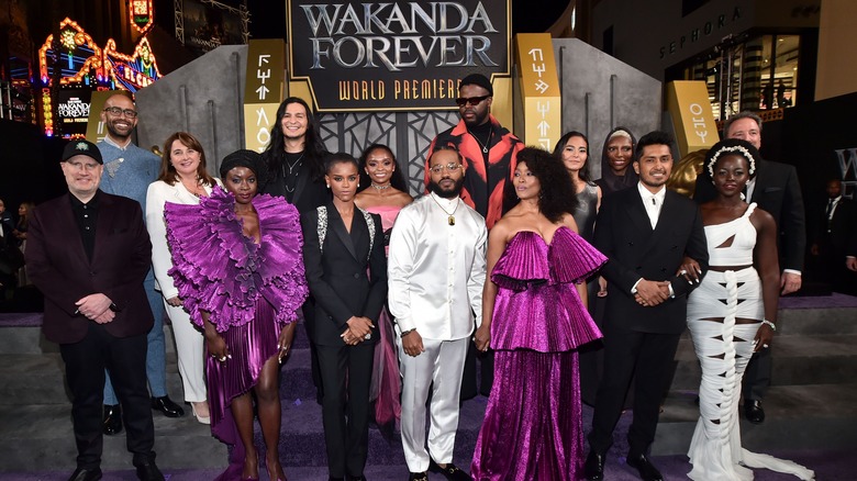 Ryan Coogler, surrounded by the cast and creative team of Black Panther: Wakanda Forever