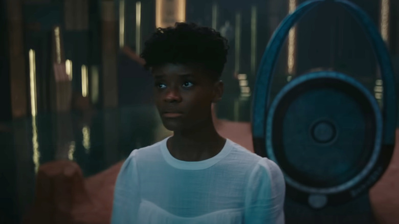 Shuri stands in a throne room in Black Panther: Wakanda Forever