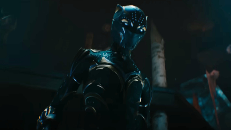 Shuri suits up in the Black Panther costume 