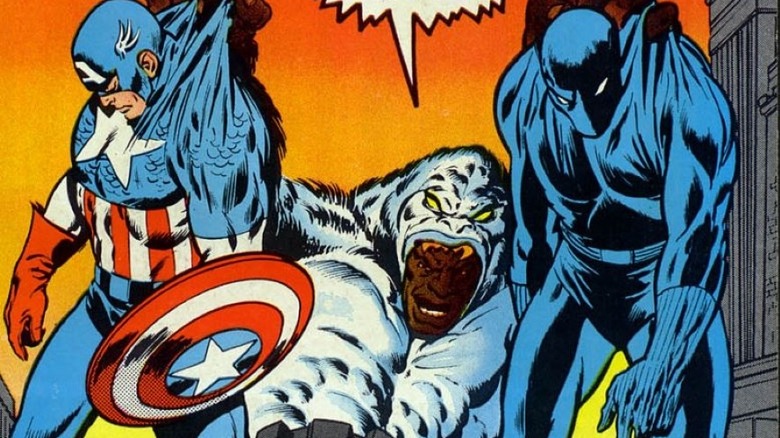 Man-Ape holding Black Panther and Captain America