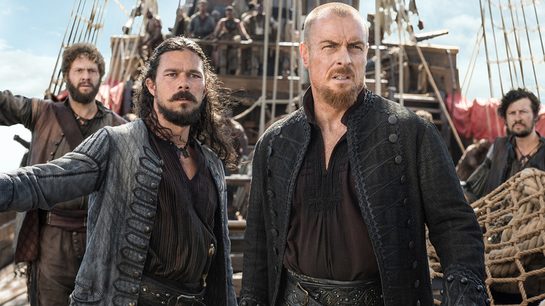 Flint, Silver and Dooley stand battle-ready in "Black Sails"