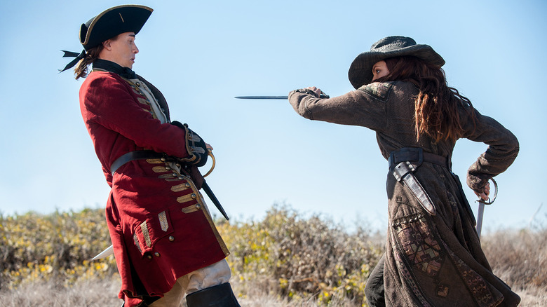 Anne Bonny threatens a redcoat on "Black Sails"