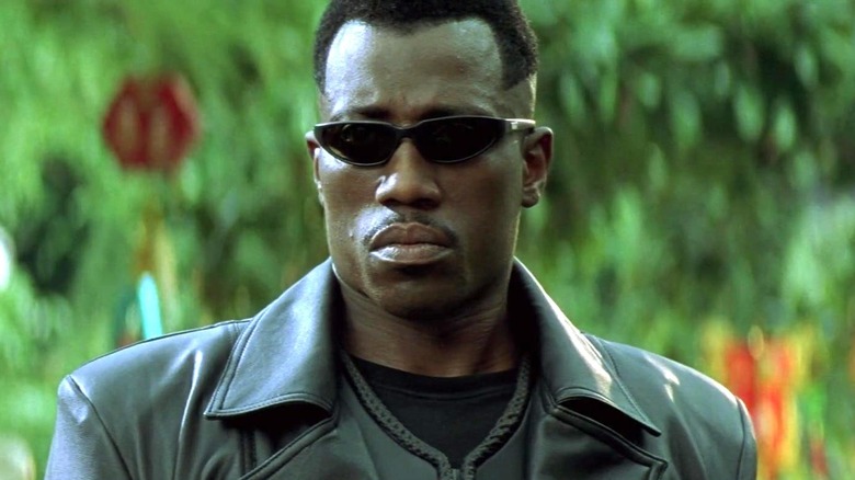 Blade wearing sunglasses and black coat